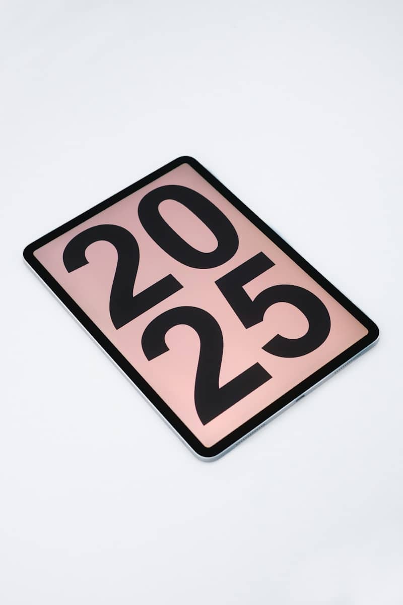 A pink and black sign that says 2012 on it