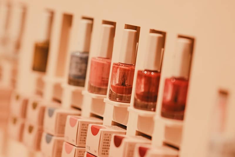 Colorful nail polish bottles in a retail display.