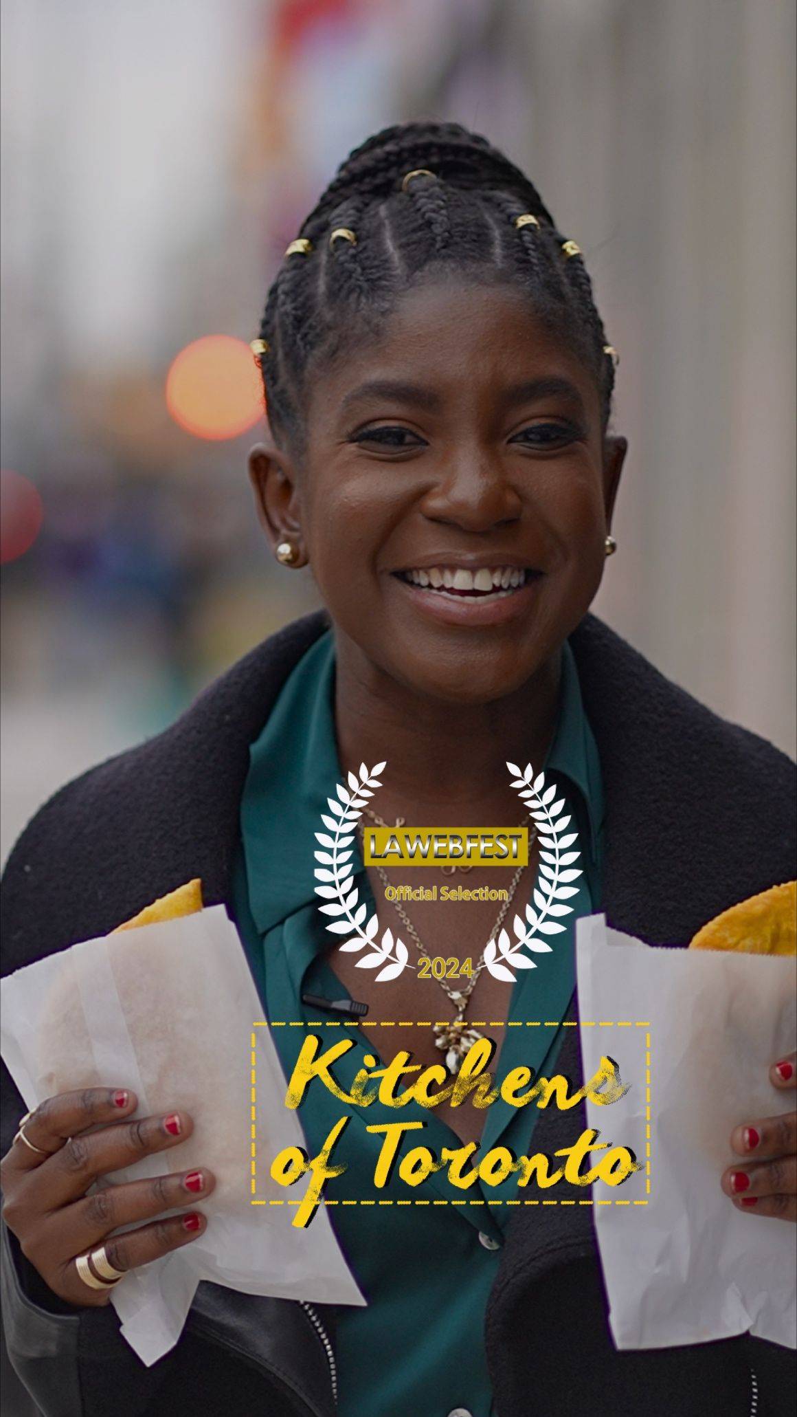 A Black woman standing outside on the street holding a Jamaican patty in each hand. Text on the image reads "Kitchens of Toronto""
