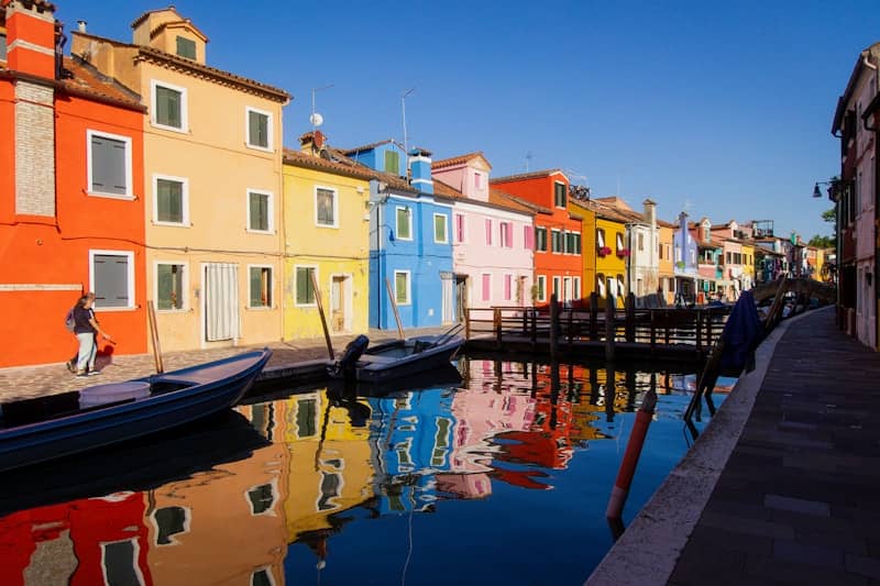 A row of houses next to a body of water