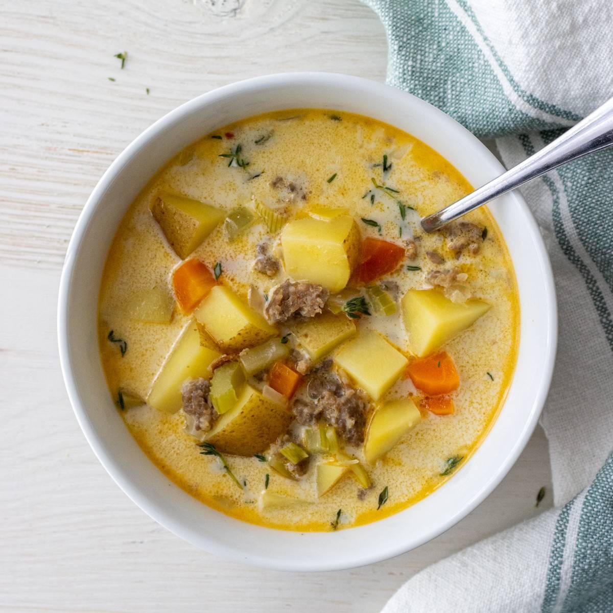 Bowl of sausage and potato soup.