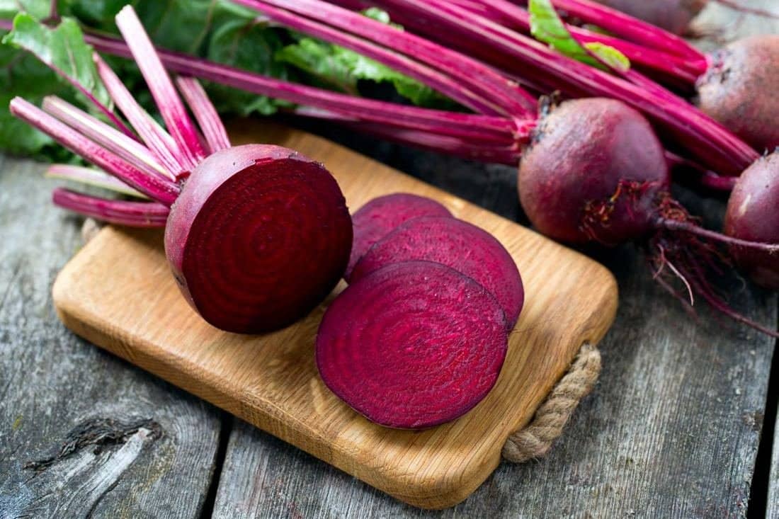 Fresh beets on a wooden board