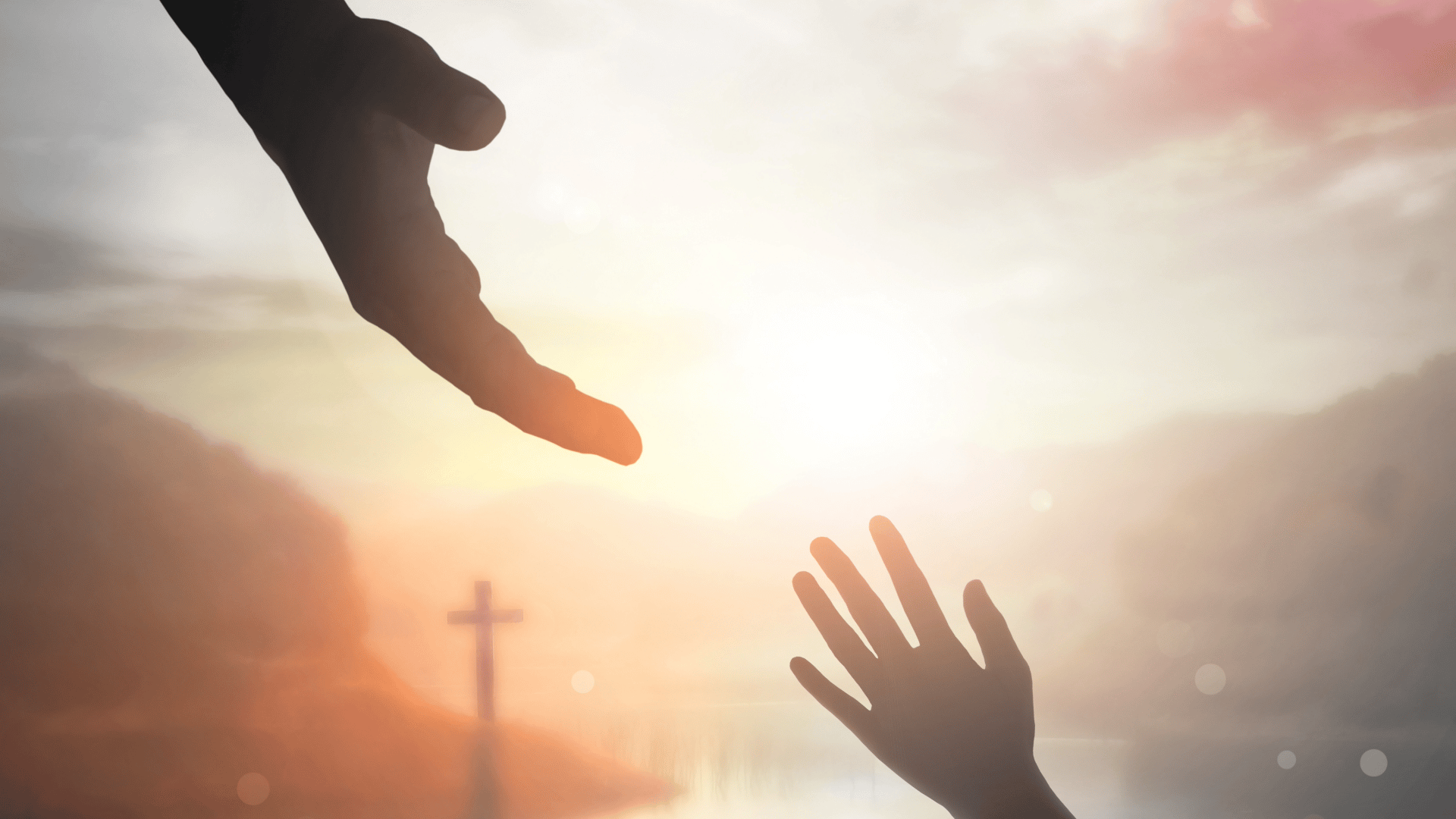 God reaching His hand to a child with a cross in the background. 