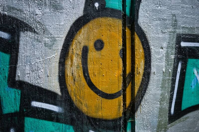 Graffiti smiley face on a concrete wall