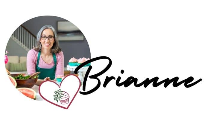 A woman wearing glasses and a heart with the name "Brianne" in script.