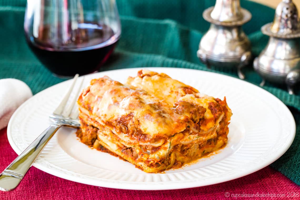 A piece of lasagna on a plate.