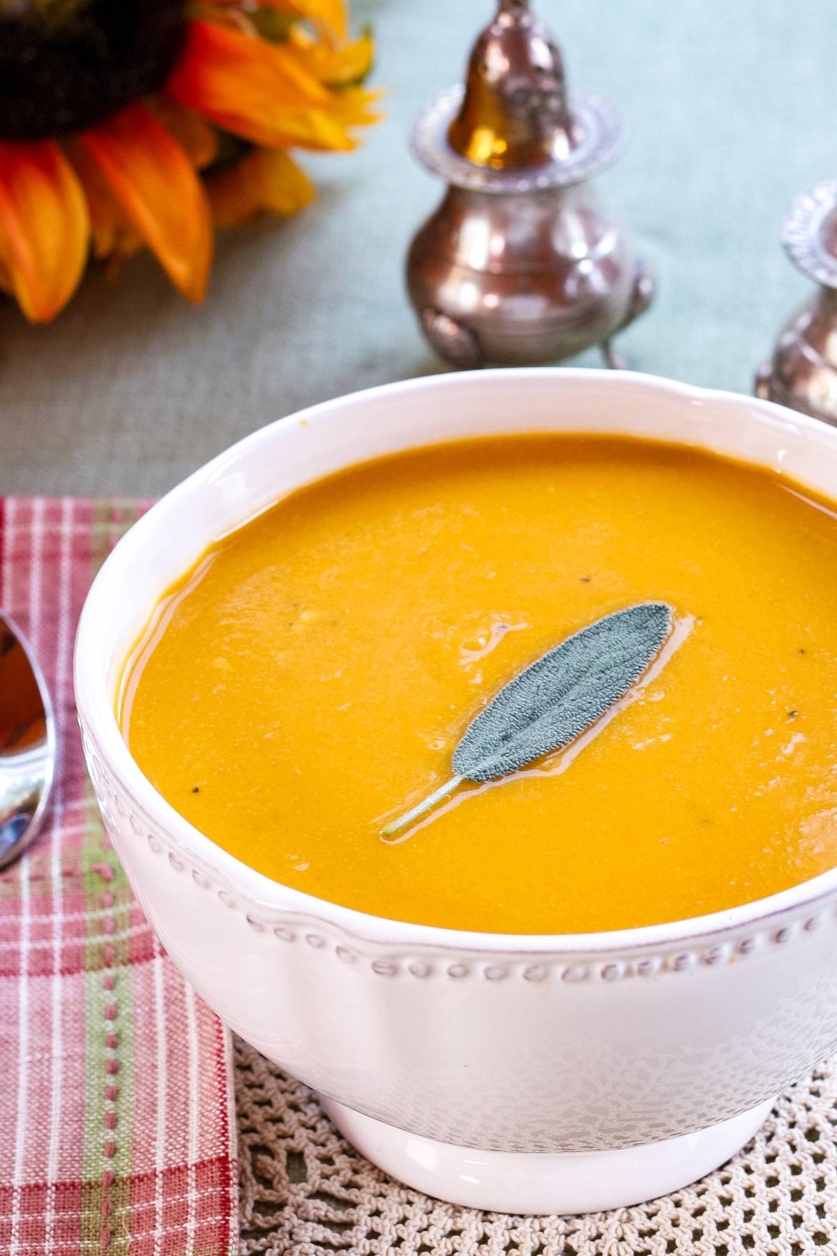 A bowl of cheddar cheese butternut squash soup.