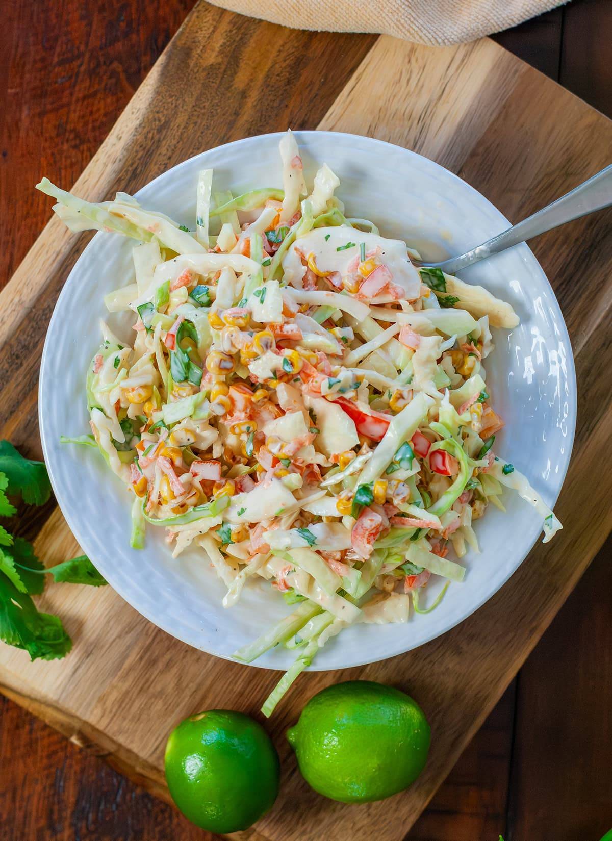 A top view of roasted corn slaw showing cabbage, corn and veggies. 