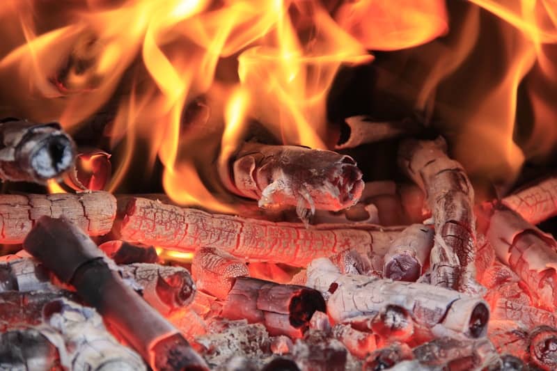 A close up of a fire burning in a fireplace