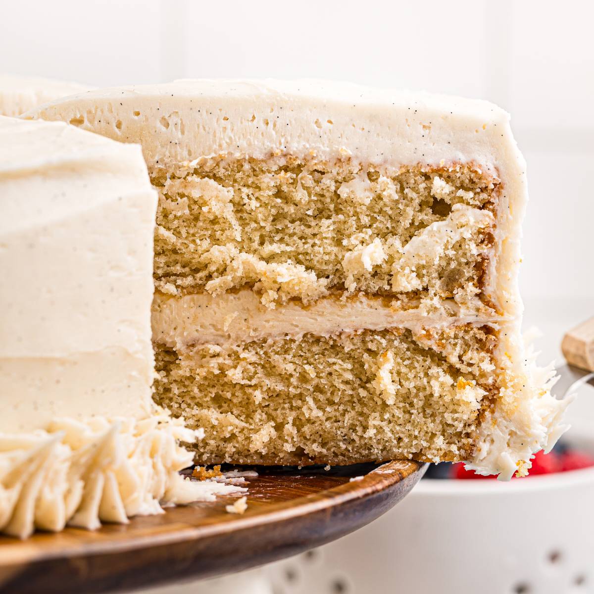 slice of vanilla layer cake with vanilla frosting