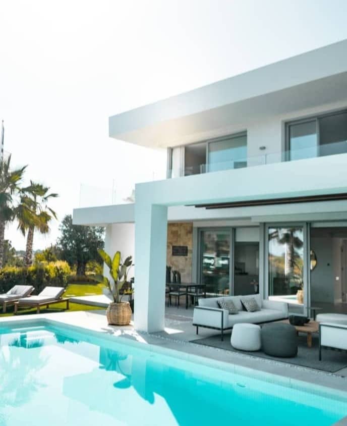 white concrete building with swimming pool