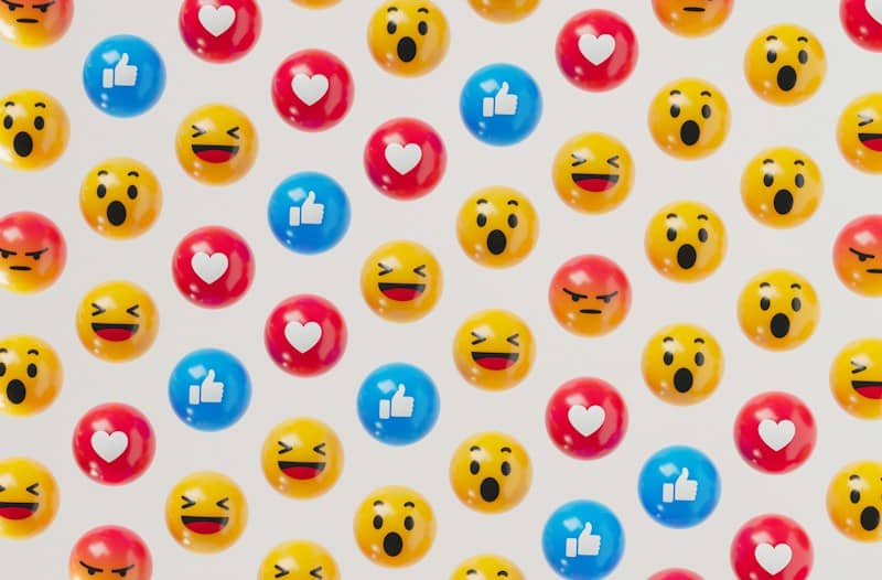 a group of smiley face balloons on a white background