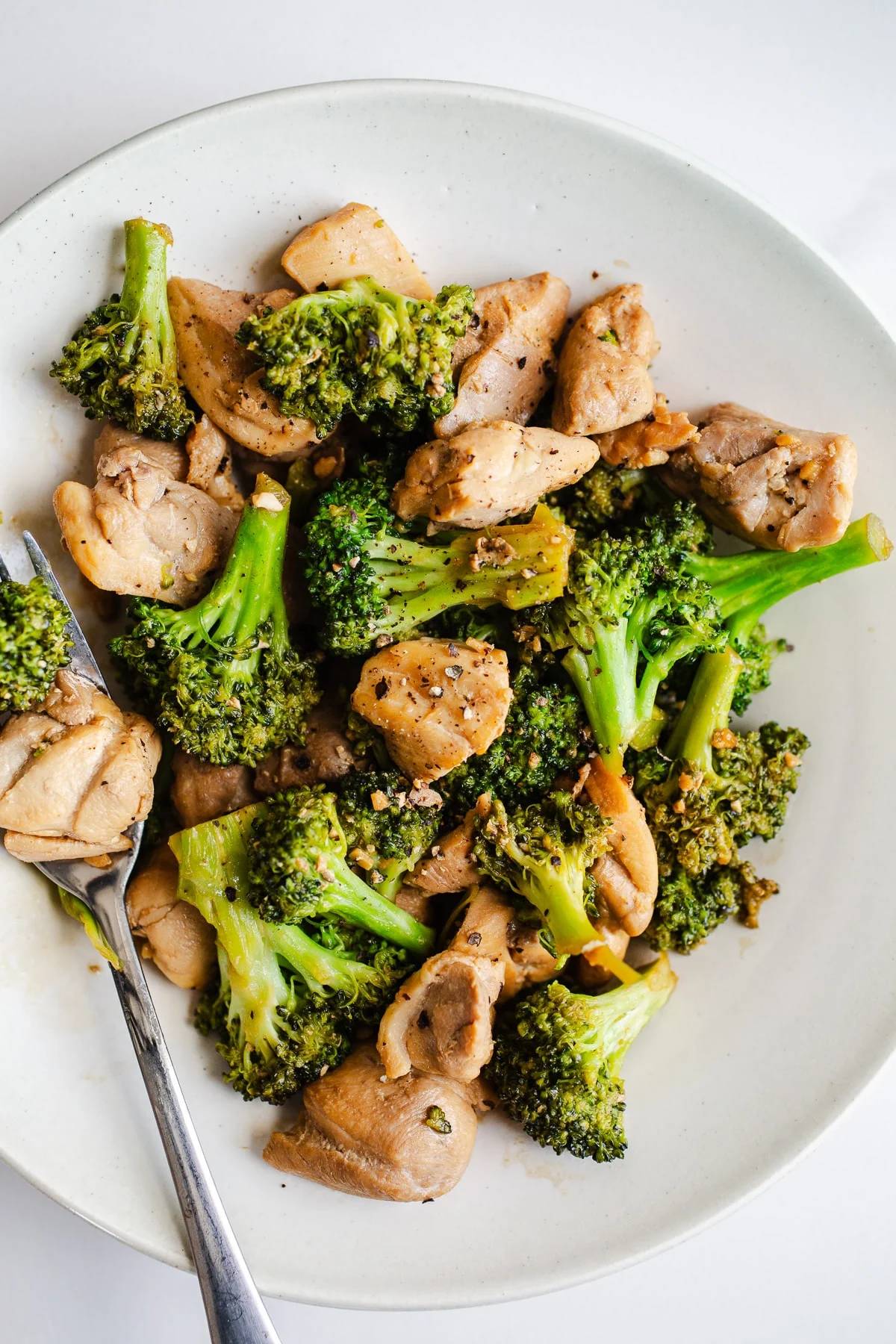 Broccoli and chicken on a plate.