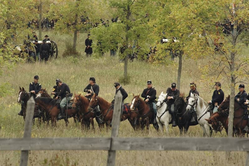 lined people riding horse