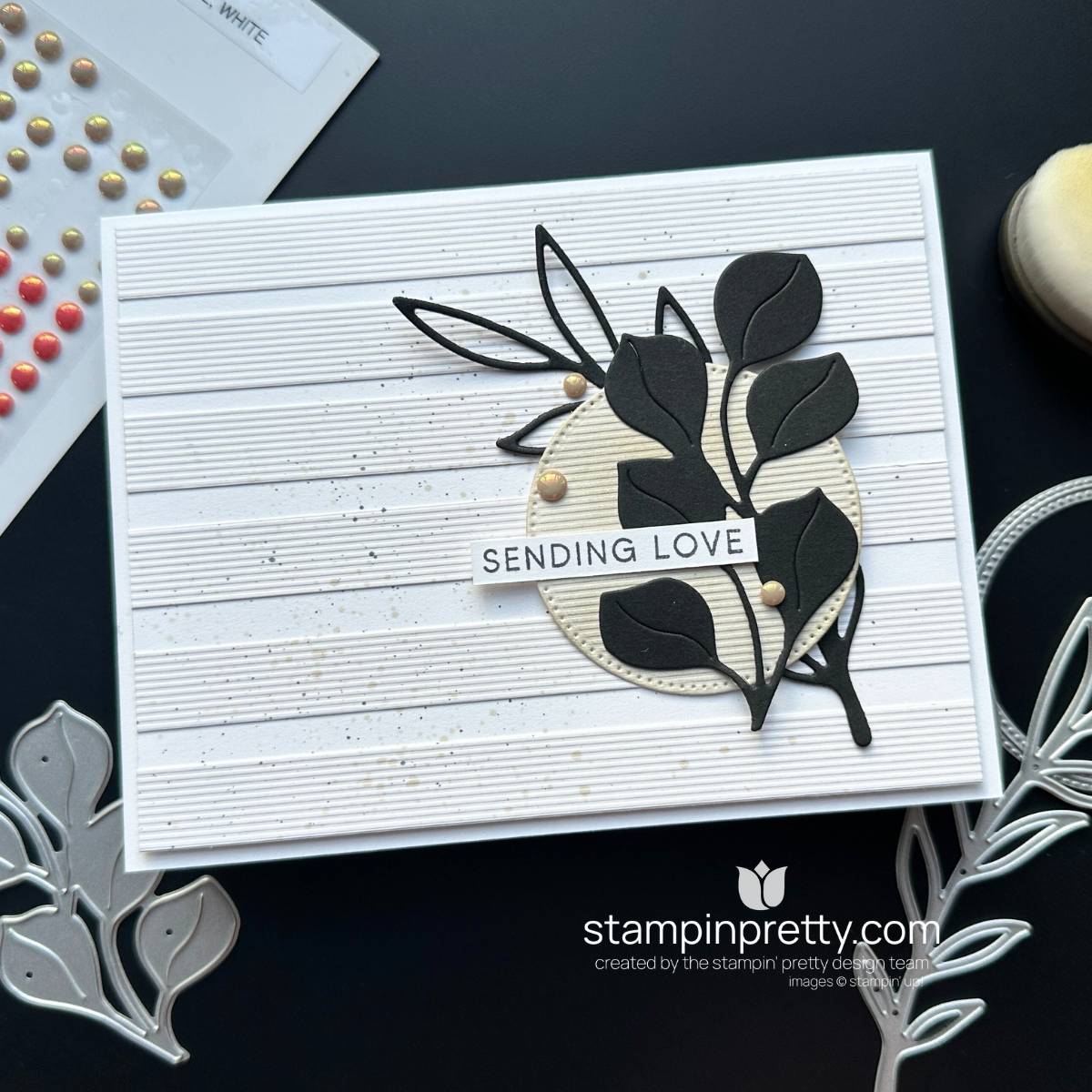 A simple card with white panels and black foliage die-cuts