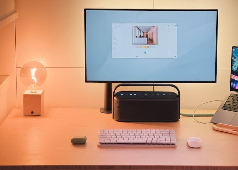 A desk with a laptop and a monitor on it