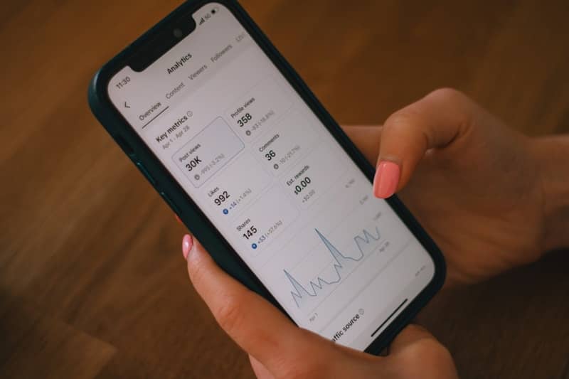 Checking data analytics on a phone.