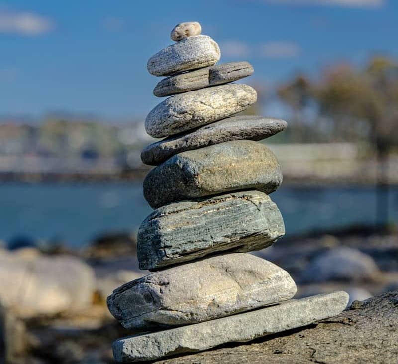 Stack of balanced stones by the water