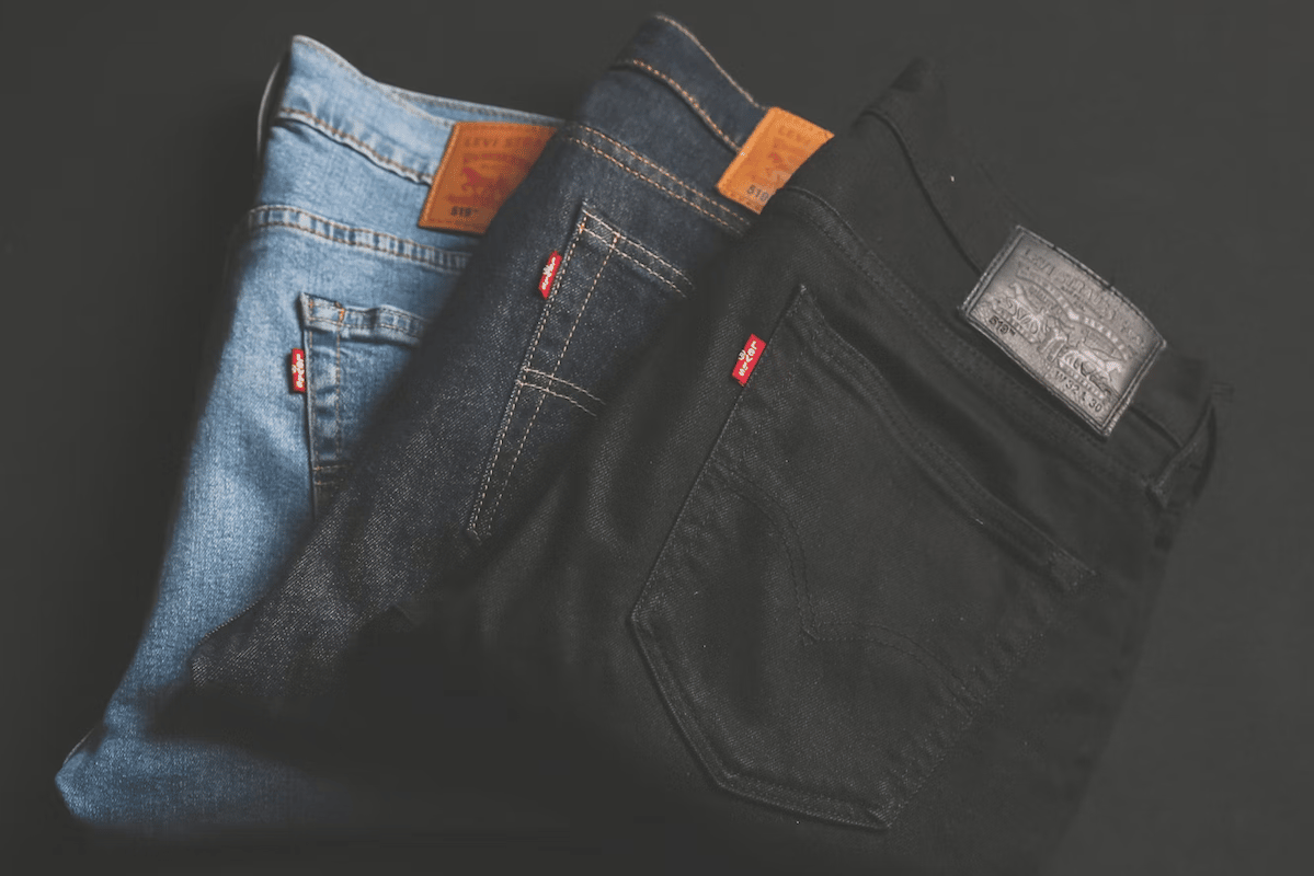 Three pairs of Levis Strauss jeans blue navy and black, best stocks to buy, learn a trade