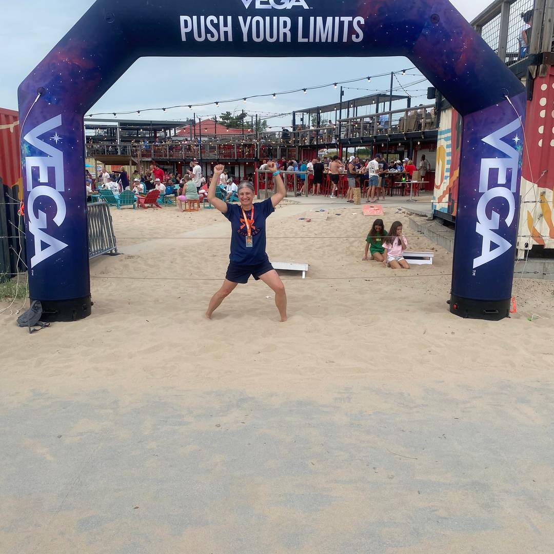 Sammy striking a strong-woman pose at the end of her Ragnar Relay.
