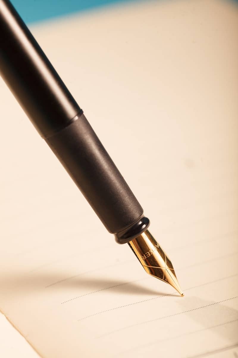 A black fountain pen ready to write.
