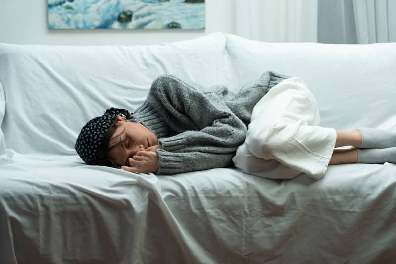 Woman sleeping on a couch