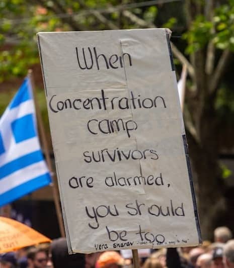 a protest sign with a message written on it