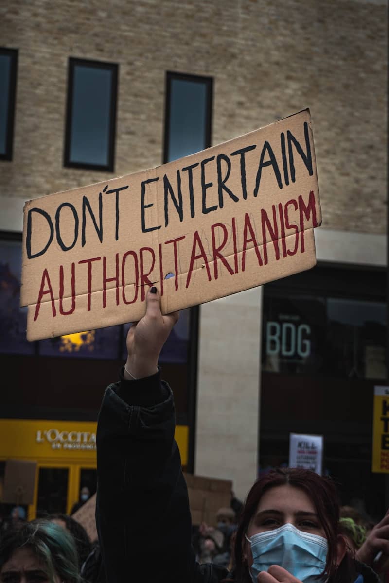 person holding white and black quote board