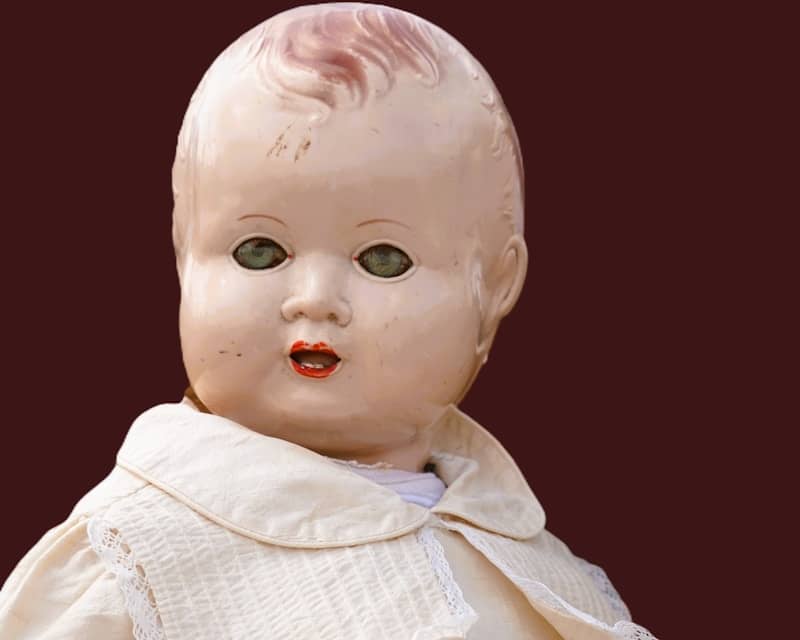 Vintage baby doll with painted features and cloth features