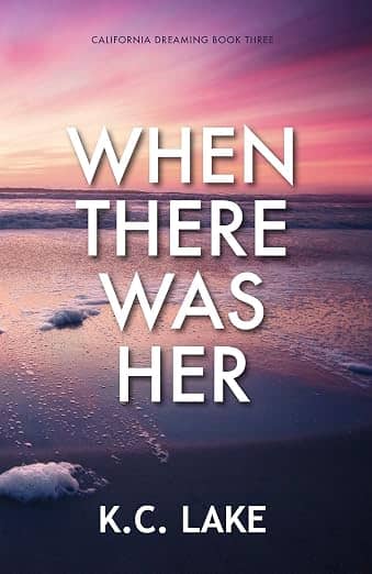 cover of When There Was Her by K.C. Lake featuring a sunset photo of the ocean in the distance with puffs of seafoam that look like snow in the foreground. Overall colors are pinkish orange skey over purplish/darker foreground