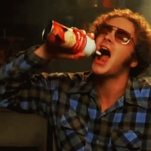 Hyde from that 70's show squirting whipped cream into his mouth - gif image
