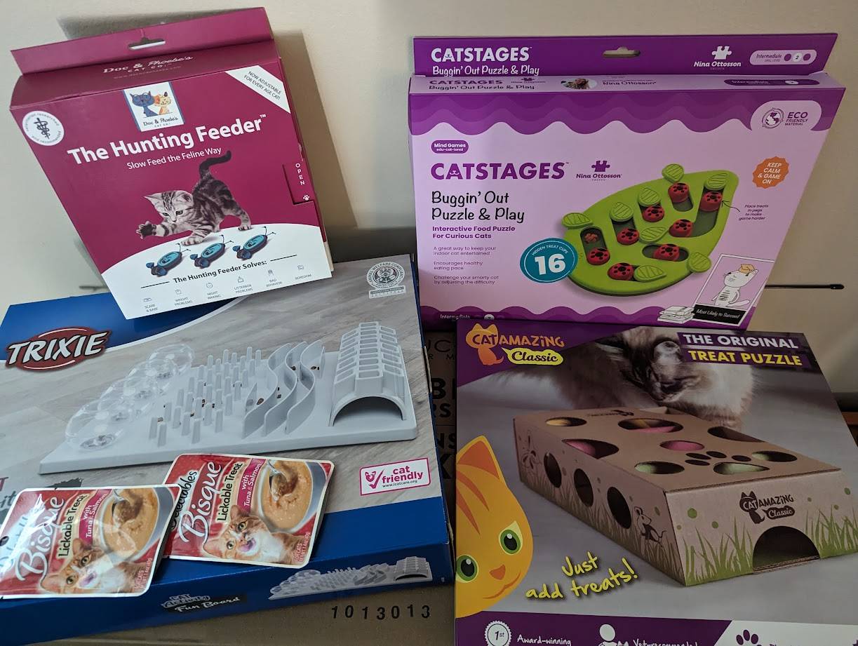 A photo of various cat food puzzles