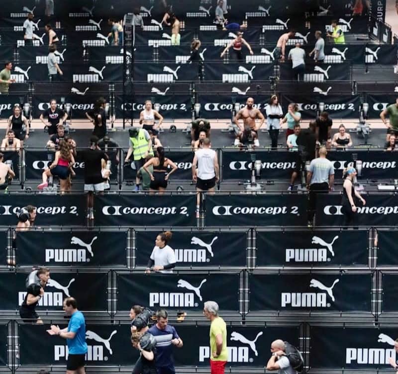 Athletes training in a stadium with puma branding.