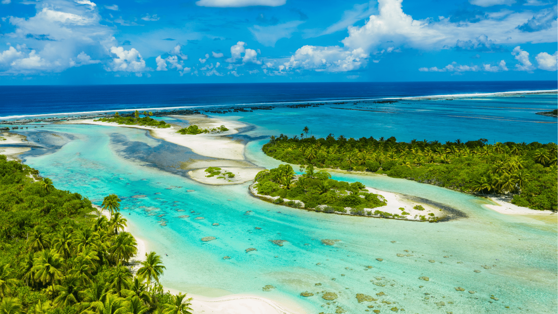 Some of the many motus that define the lagoons of the Society Islands