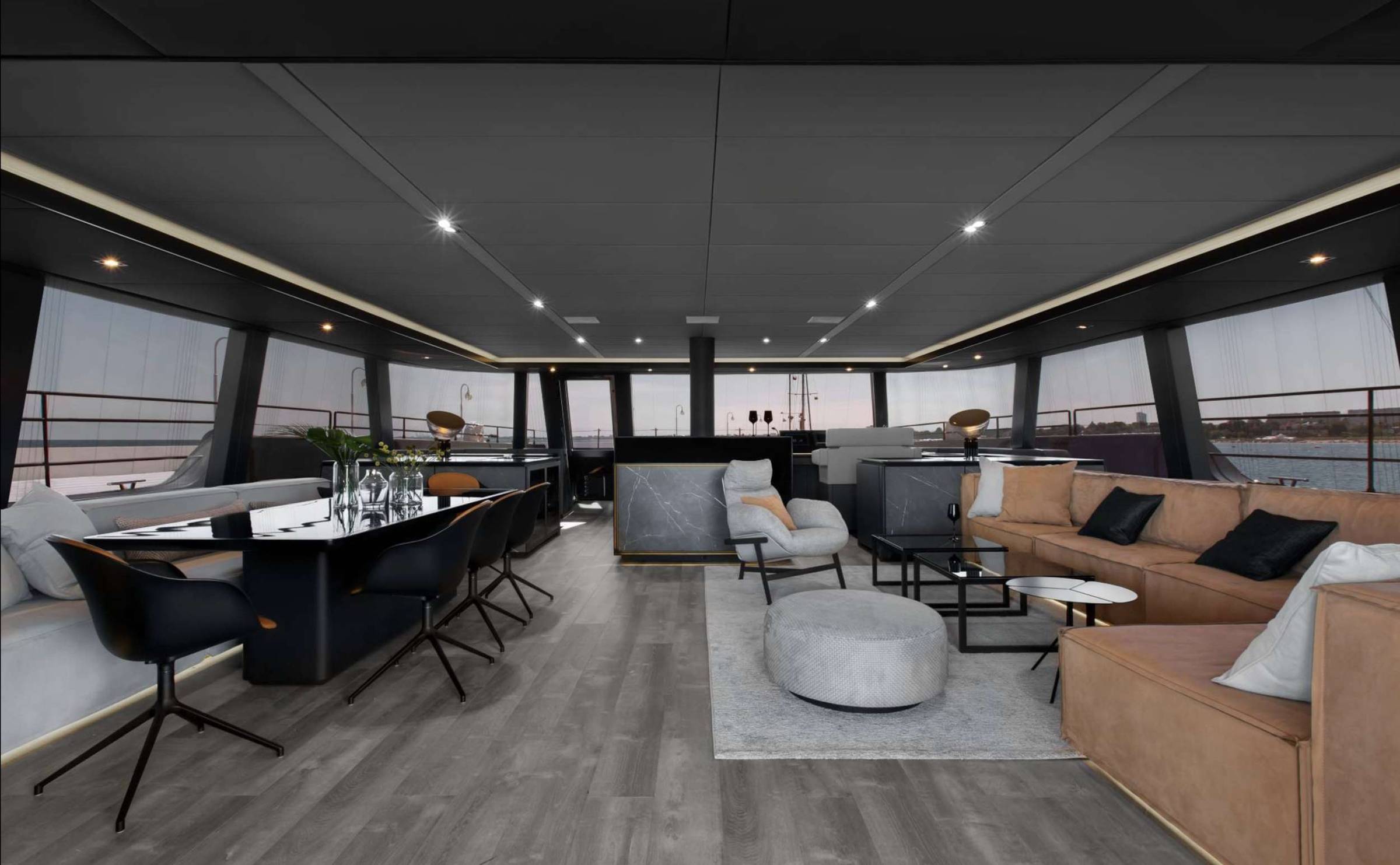 Main saloon The interior of GRAYONE sets the tone immediately. Dark tones, clean lines, and a layout that flows from dining to lounge