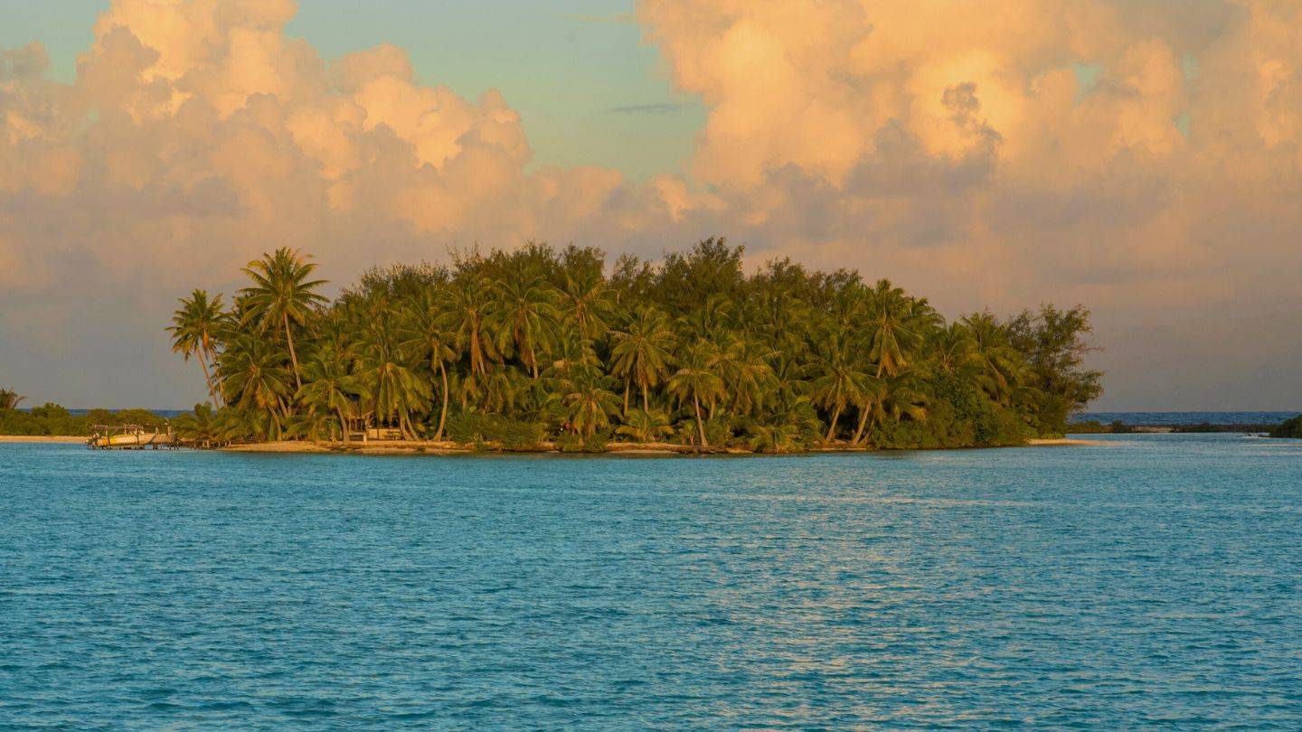 One of the hundreds of motus that form part of the surrounding lagoons in the Society Islands