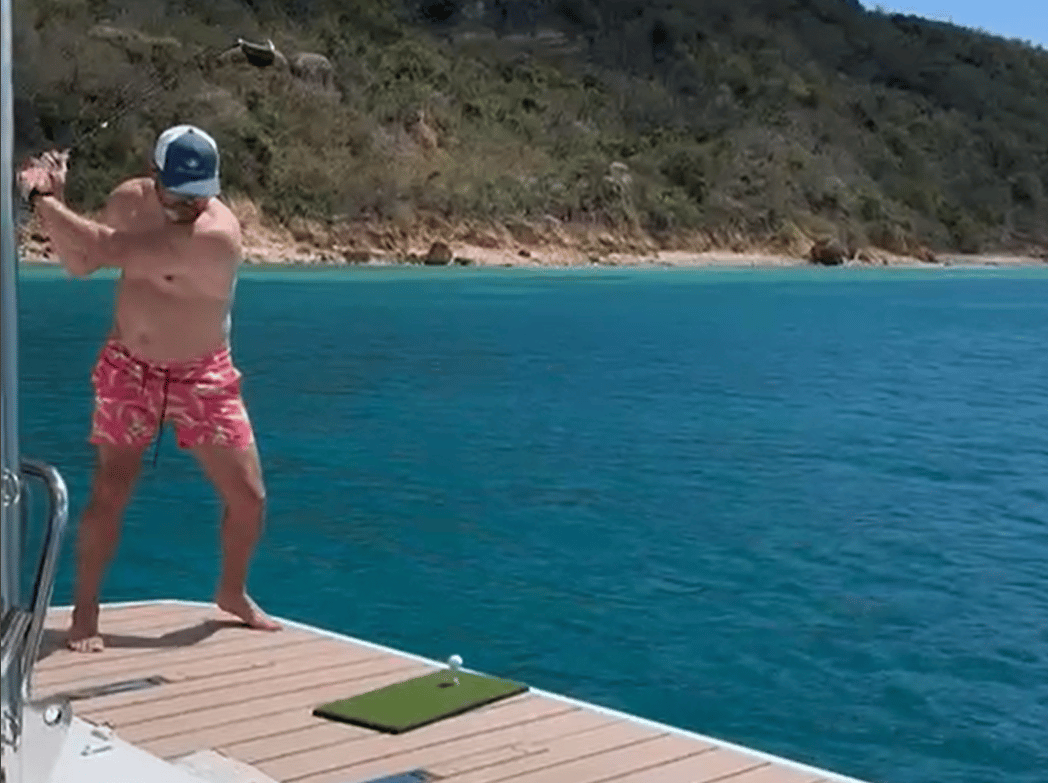 Hitting (biodegradable) golf balls off the swim platform