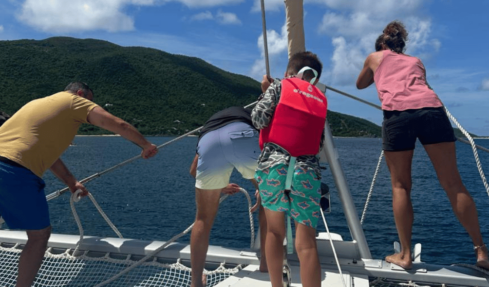 Helping the crew to tie up a mooring ball