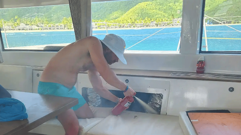 Putting out a small electrical fire on our Antigua charter trip