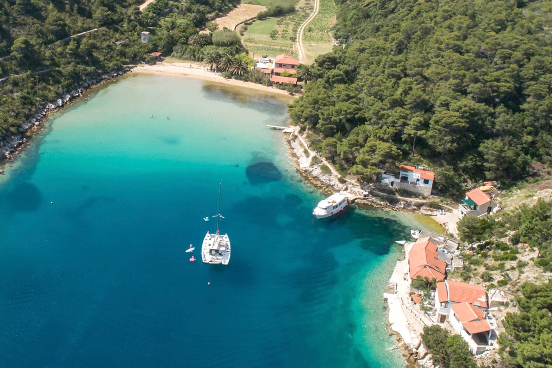 A crewed yacht charter anchored at a Croatian bay