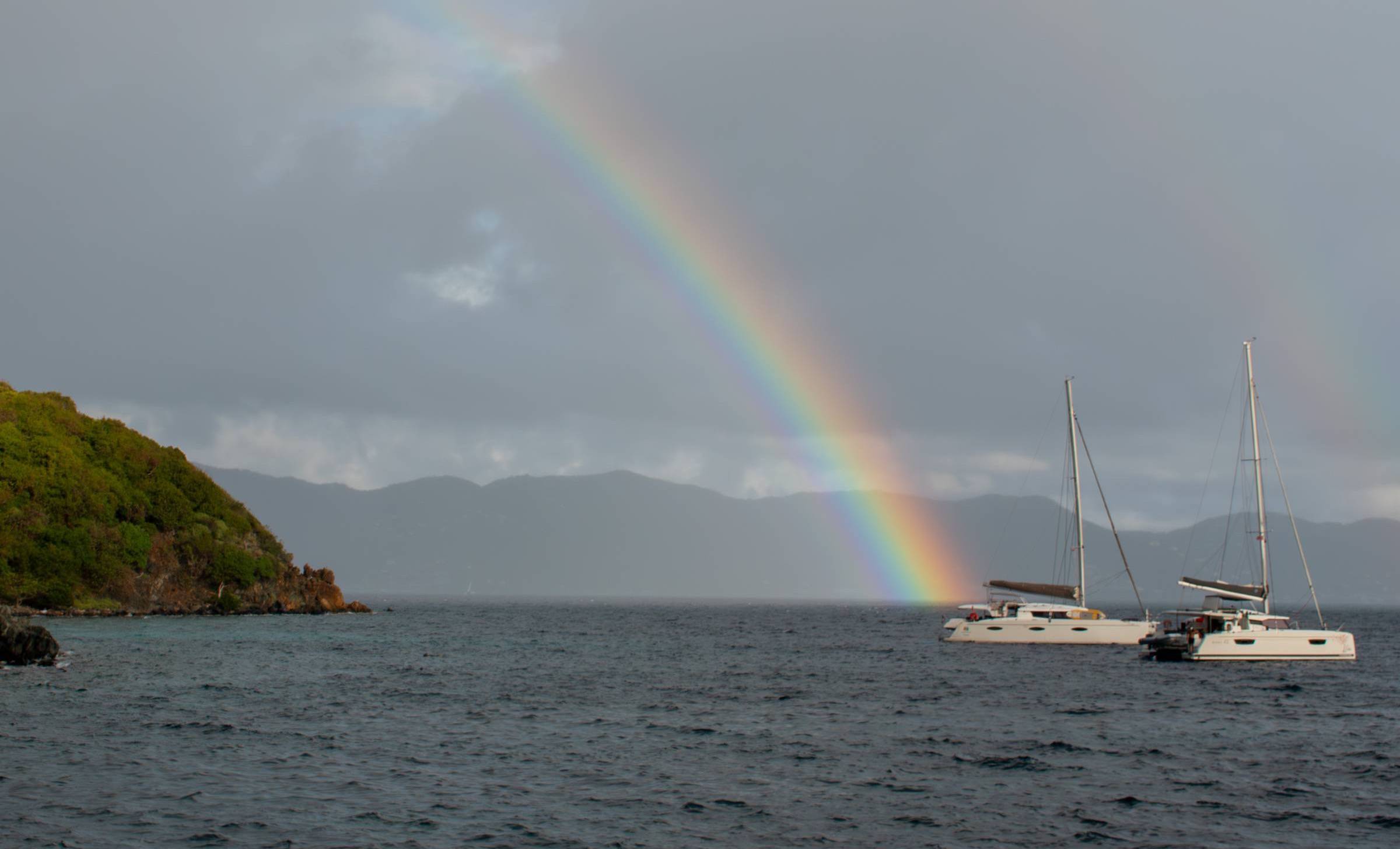 A double rainbow over anchored catamarans in the BVI - the kind moment no itinerary can plan for. Photo: guest Kelly Wilson