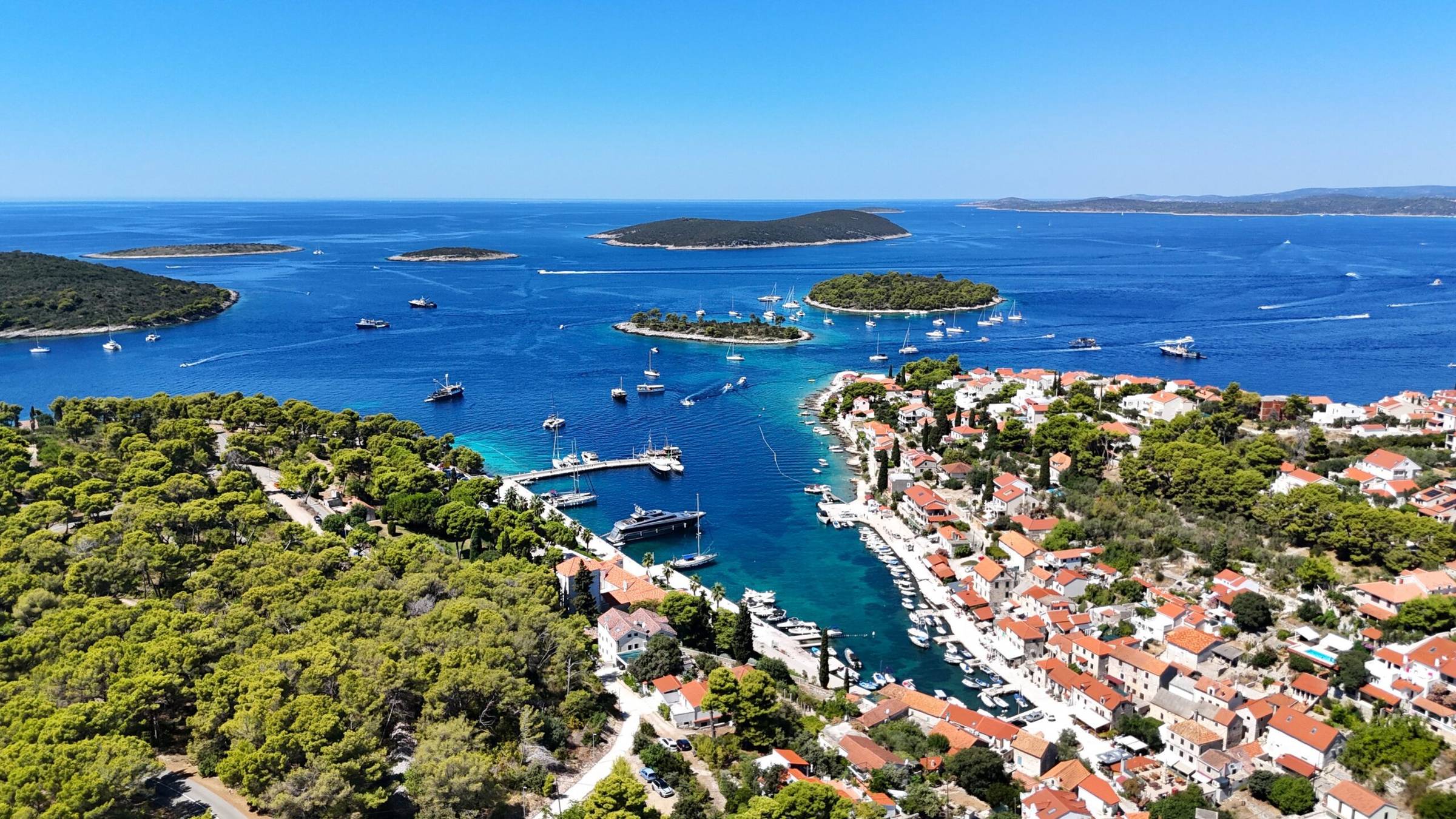 Aerial view of Croatia’s islands, harbors, and crystal-clear waters.