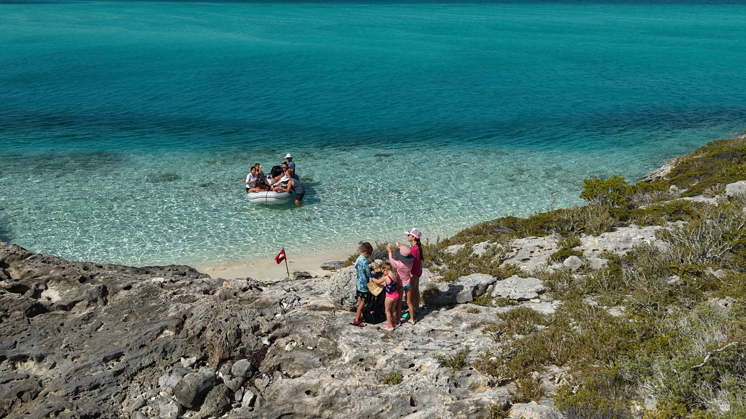 The kids searching for the lost pieces of the map at Hog Cay