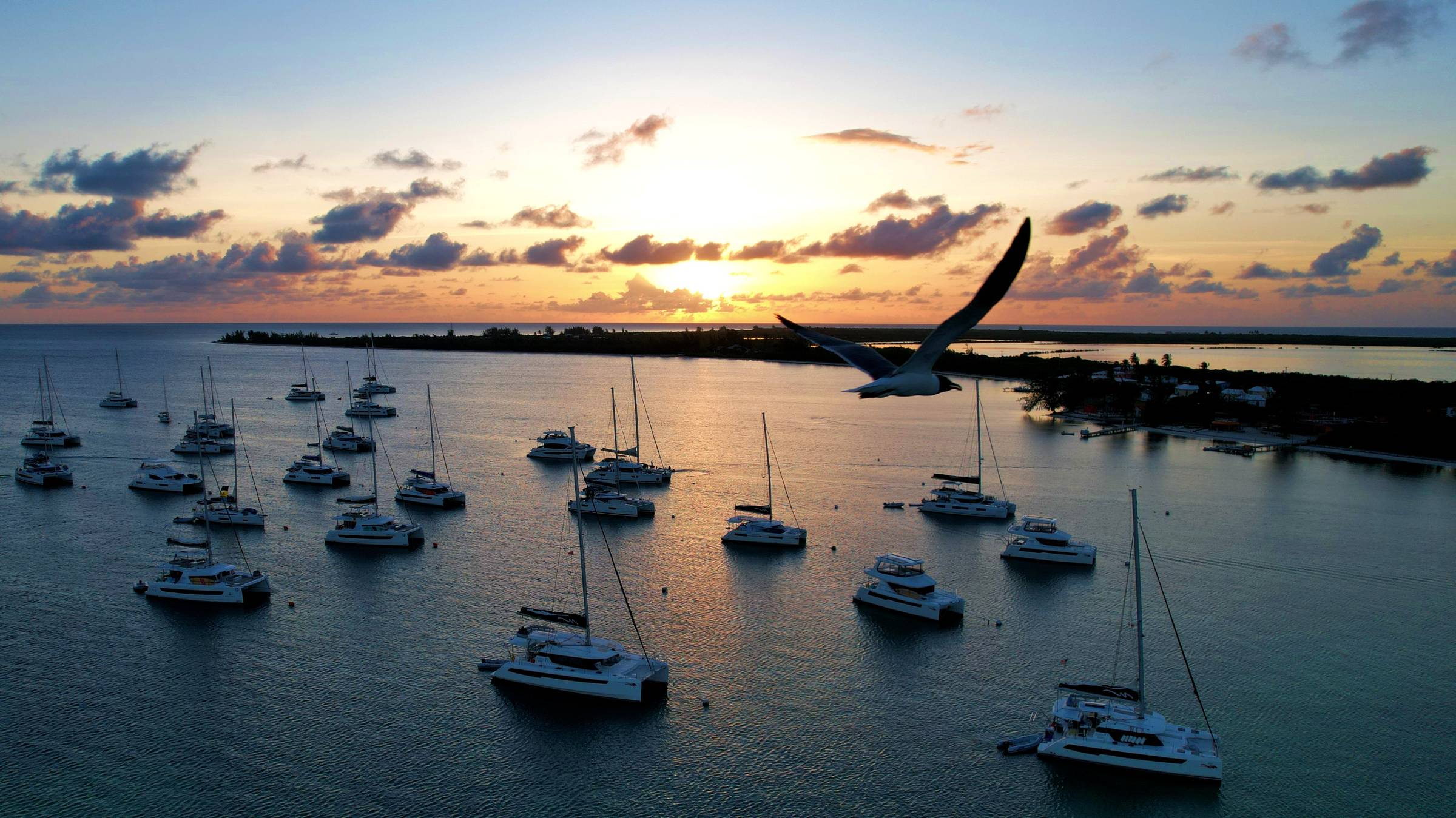 The sun setting behind the Setting Point mooring field