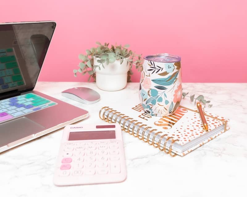 a laptop computer sitting on top of a white table