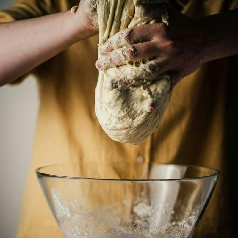 person holding white ice cream