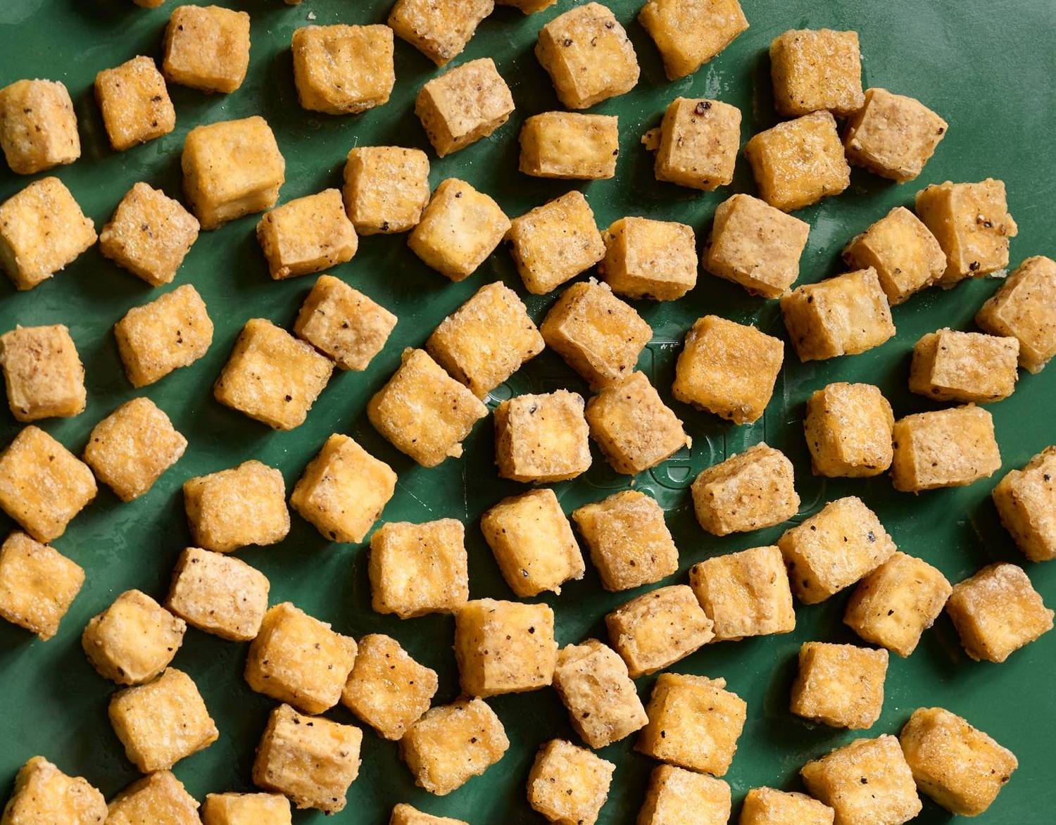 Baked tofu on a sheet pan.