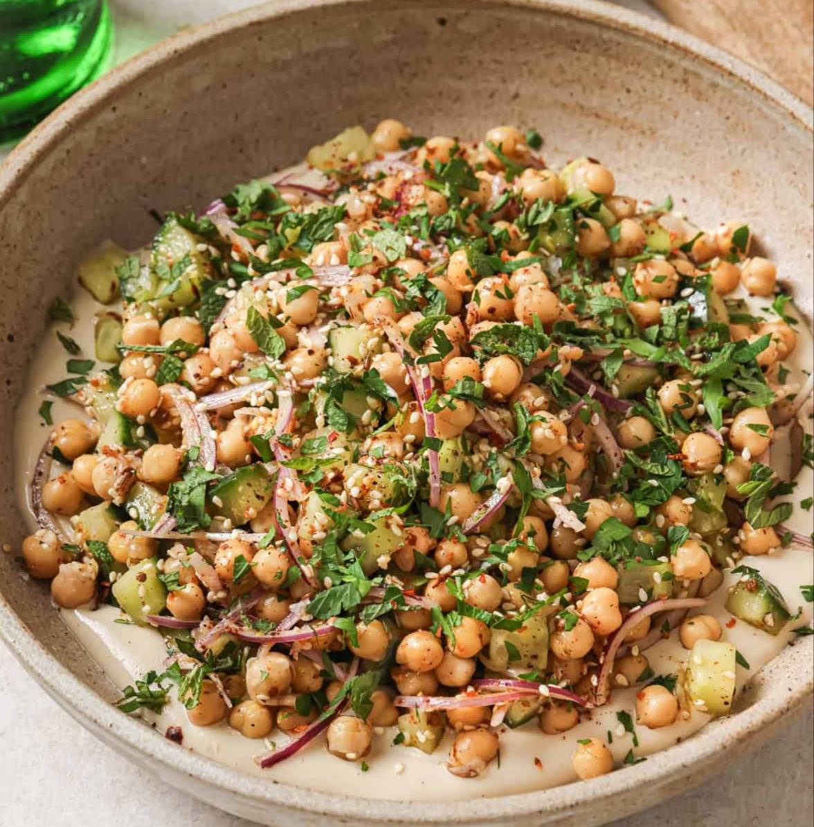 Angled front view of chickpea salad with a soft, blurred background.