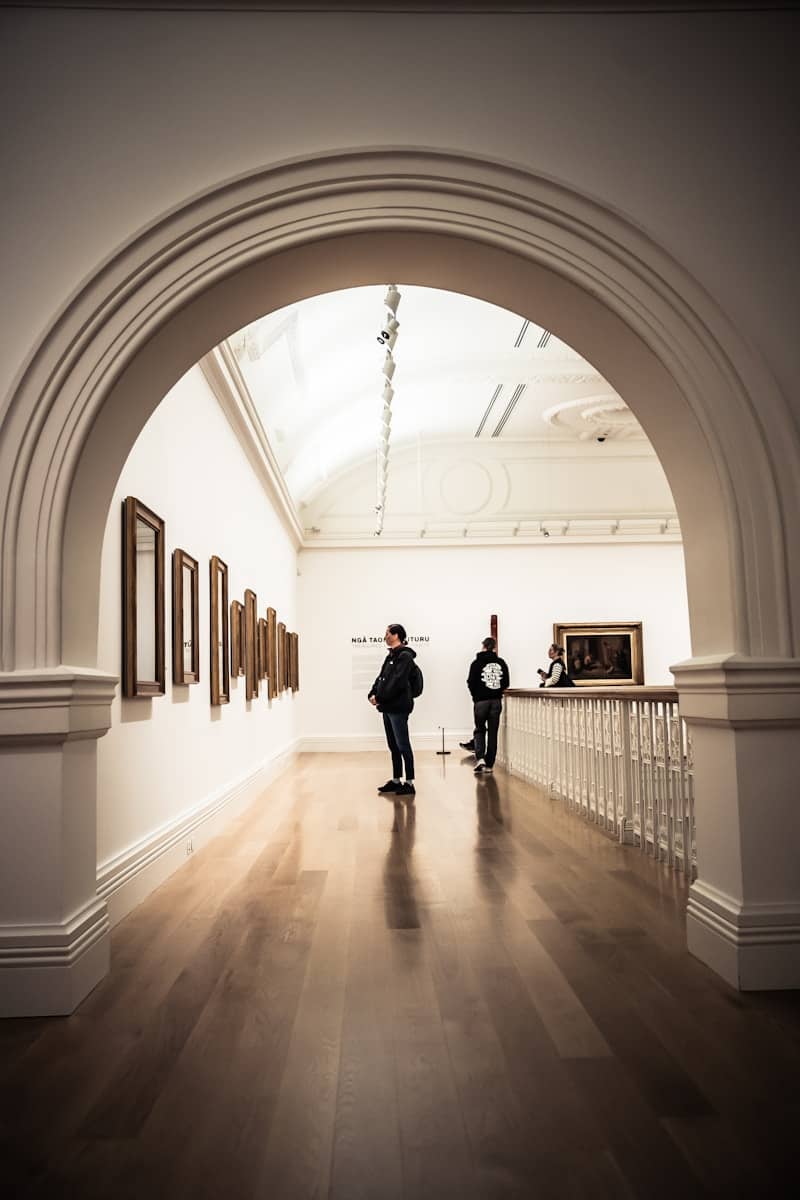 People viewing art in a museum gallery
