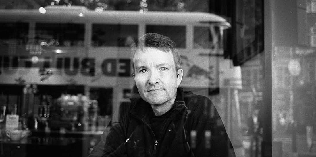 A photograph of the artist Stephen Kennedy, black and white